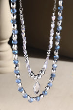 Layered Silver Beaded Necklace with Crystal Drop Pendant