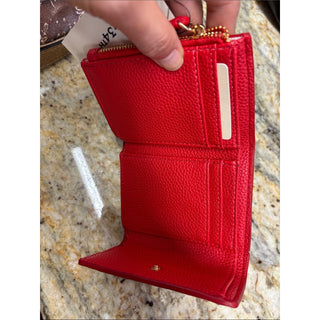 On 34th Red Pebbled Leather Wallet with Gold Bow Accent